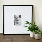 Oversized Mount Wooden 18x18 Black Frame for 7x5 with a Photo of a Plant and PF&A Logo