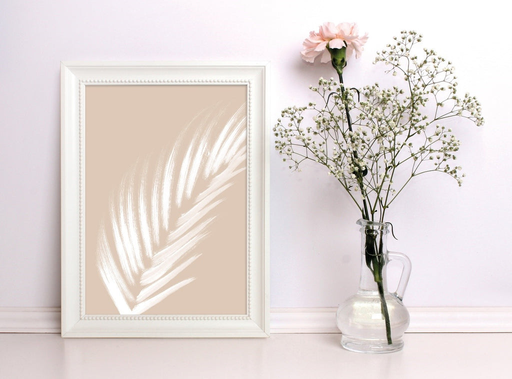 White Leaf in Photo Frame Against Wall with Flowers in Vase