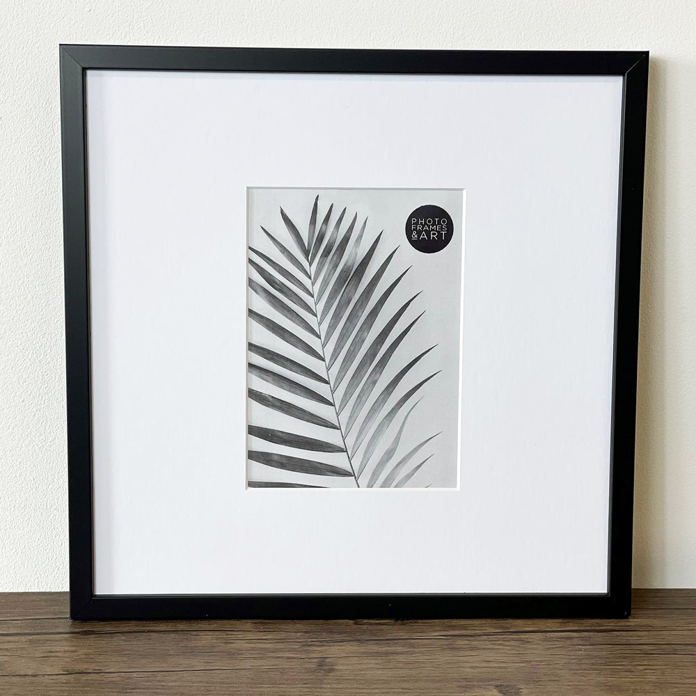 Oversized Mount Wooden 12x12 Black Frame for 7x5 with a Photo of a Plant and PF&A Logo 