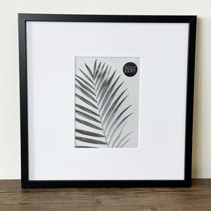 Oversized Mount Wooden 12x12 Black Frame for 7x5 with a Photo of a Plant and PF&A Logo 