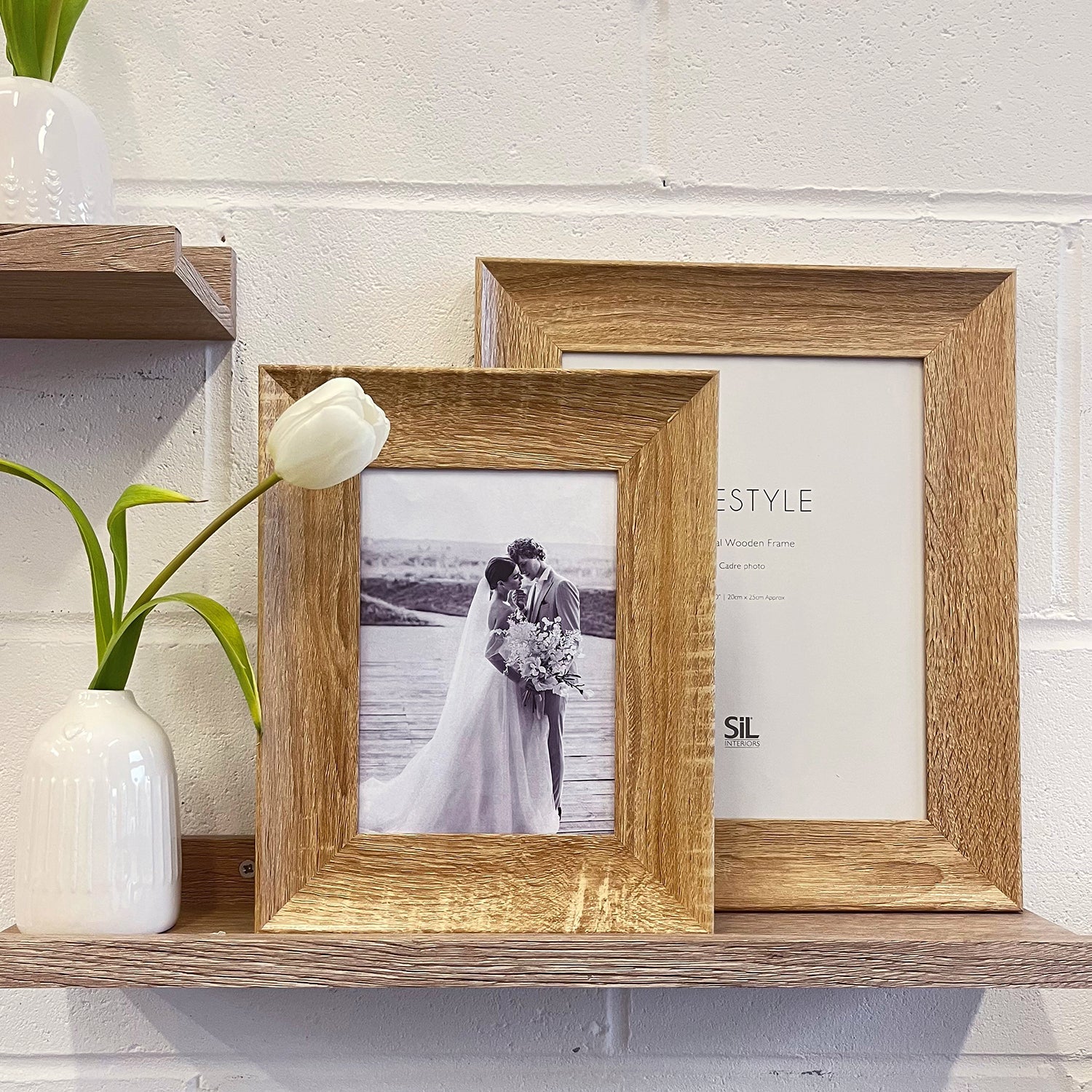Wood Frame on shelf with a wedding photo of a couple